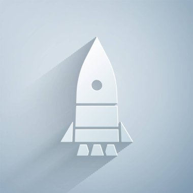 Kağıt kesiği Roket gemi simgesi gri arkaplanda izole edildi. Uzay yolculuğu. Kağıt sanatı tarzı. Vektör İllüstrasyonu