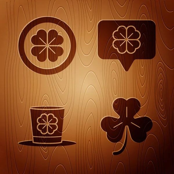 Set Four leaf clover, Gold coin with four leaf clover, Leprechaun hat and four leaf clover and Four leaf clover in speech bubble on wooden background. Vector