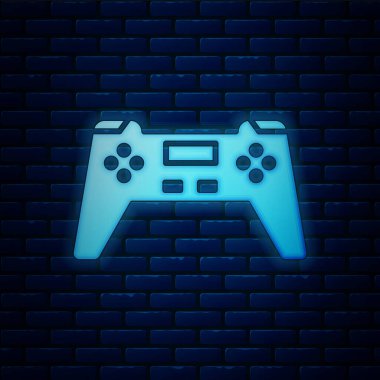 Parlayan neon oyun alanı simgesi tuğla duvar arka planında izole edildi. Oyun kontrolörü. Vektör İllüstrasyonu