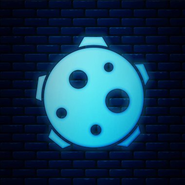 Parlayan neon gezegen simgesi tuğla duvar arka planında izole edilmiş. Vektör İllüstrasyonu