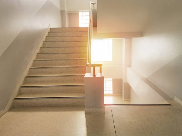 Building stairs and sun rise In the building.