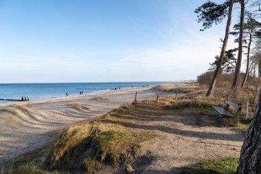 WARNEMUENDE, GERMANY - FEBRUARY 15: The beach at Warnemuende on a beautiful sunny winter day. February 15, 2020 in Warnemuende, Germany