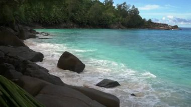 Ocean waves and granite rocks Anse Intendance Mahe Island Seychelles.