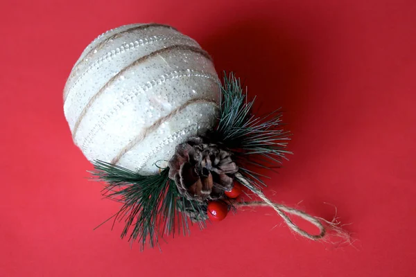 Christmas ornament on red background — Stock Photo, Image