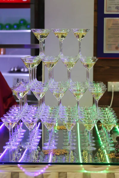 Champagne tower with four rows of glasses