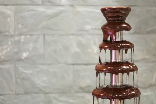 Chocolate fondue fountain at the party — Stock Photo, Image