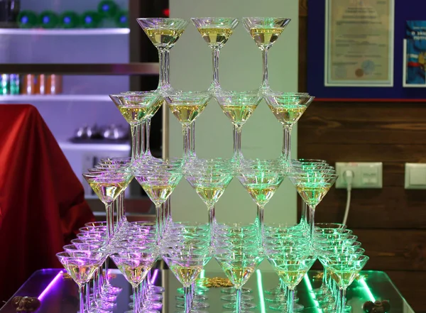 Champagne tower with four rows of glasses