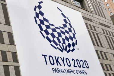 Tokyo, Japan, March 23, 2020 - A signboard of Tokyo 2020 Paralympic Games on display outside the Tokyo Metropolitan Government Building in Shinjuku ward. clipart