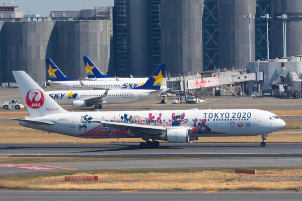 March 18, 2020, Tokyo, Japan - Japan Airlines (JAL) aircraft with logos of Tokyo Olympic Games 2020 (Tokyo 2020) is seen in Tokyo International Airport commonly known as Haneda Airport.