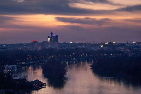 Belgrade, Serbia, Confluence of the Sava and the Danube rivers with Geneks Tower in background after sunset