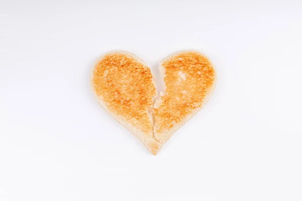 Bread toast broken heart symbol, divorce, breakup, unhappy relationship concept — Stock Photo, Image