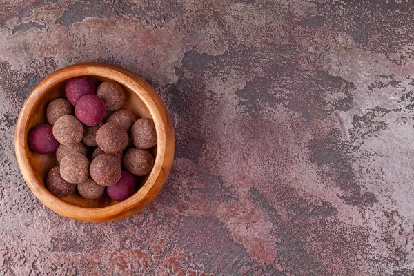 Homemade Raw Vegan Cacao Energy Balls in Wooden Bowl on Brown Marble Background — ストック写真