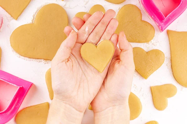 Woman Hands Holding the Raw Heart Shaped Cookie — Stock Photo, Image