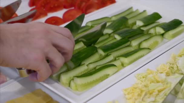 Man Hand Take a Piece of Cucumber from Self-service buffet Table with Breakfast — стоковое видео