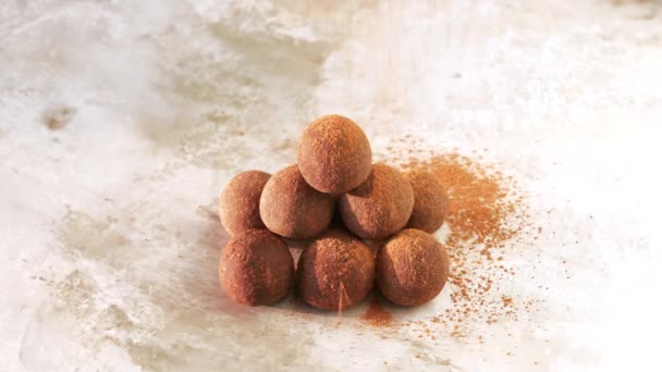 Homemade Raw Vegan Sweet Energy Balls Lying in stack Cacao Powder Sprinkled — Stock Video