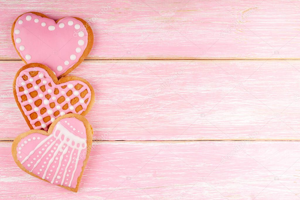 Handmade Heart Shaped Cookies on Pink Wooden Background for Valentines Day