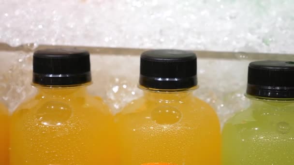 Close Up of Fresh Squeezed Juice In Plastic Bottles At Supermarket — Stock video