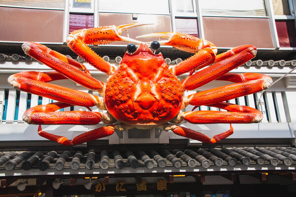 Движущийся крабовидный рекламный щит ресторана Канидураку. 14 ноября 2019 г.

