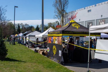Riley park farmers market open during the COVID-19 pandemic, with lines to help with social distancing.  Vancouver BC Canada    April 18th2020