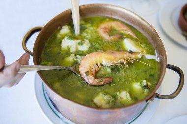 Arroz de Tamboril or soupy seafood rice, portuguese recipe clipart