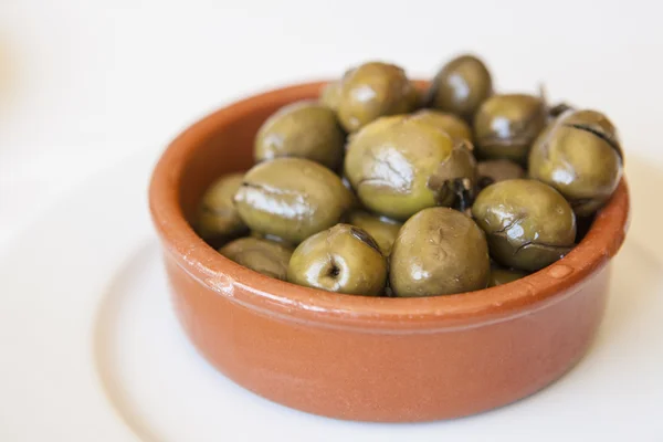 Zelený drcený marinované olivy — Stock fotografie