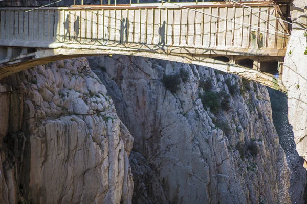 Visitors shadows crossing the suspension bridge at Gaitanes Gorg — Stock Photo, Image