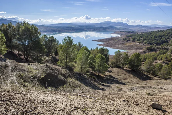 Reservoir landscape with windmills at bottom — Stock Photo, Image