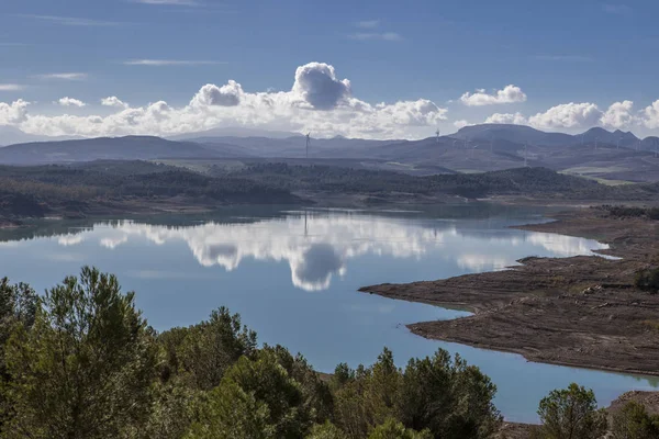 Reservoir landscape with windmills at bottom — Stock Photo, Image