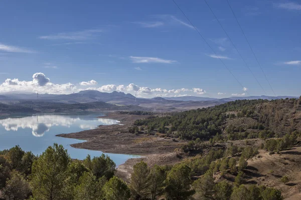 Reservoir landscape with windmills at bottom — Stock Photo, Image