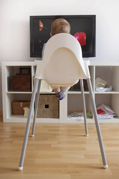 Baby boy watching cartoons on TV — Stock Photo, Image