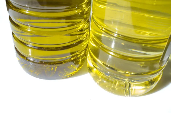 Olive versus sunflower oil bottled. Lower view — Stock Photo, Image