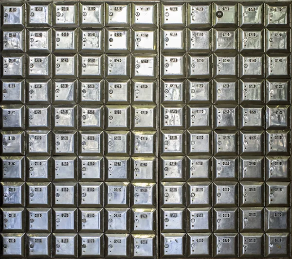 Wall full of rows of metal post office boxes — Stock Photo, Image