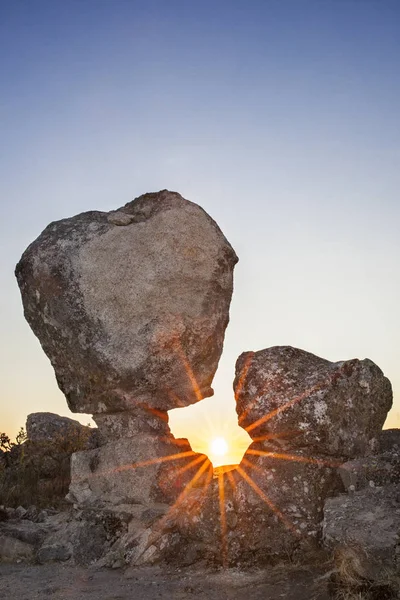 Sun rising between megalithic monument, Montanchez, Spain — Stock Photo, Image