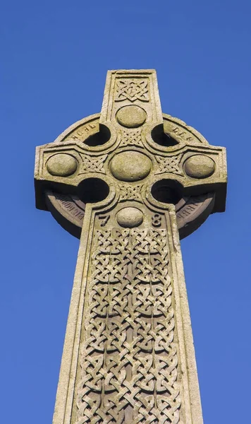 Celtic cross against blue sky