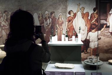 Woman taking pictures with smartphone to museum ancient pieces clipart