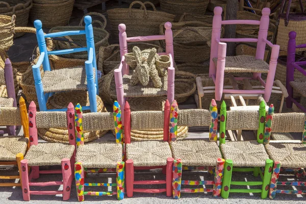 Painted children chairs at handicraft shop . Alpujarras, Spain — Stock Photo, Image