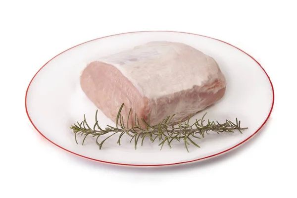 Raw loin of pork on plate — Stock Photo, Image