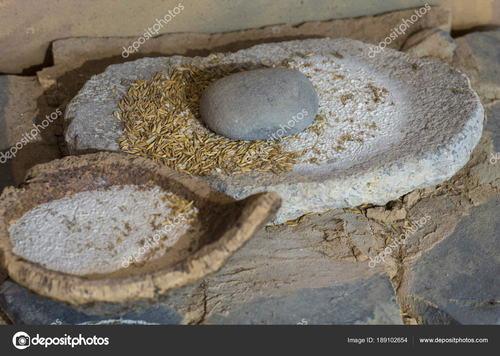 Neolithic era hand mill stone with barley and flour bowl made — Stock  Editorial Photo © WHPics #189102654