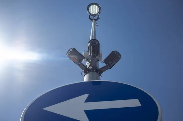 Three surveillance cameras attached on led light pole with direc — Stock Photo, Image