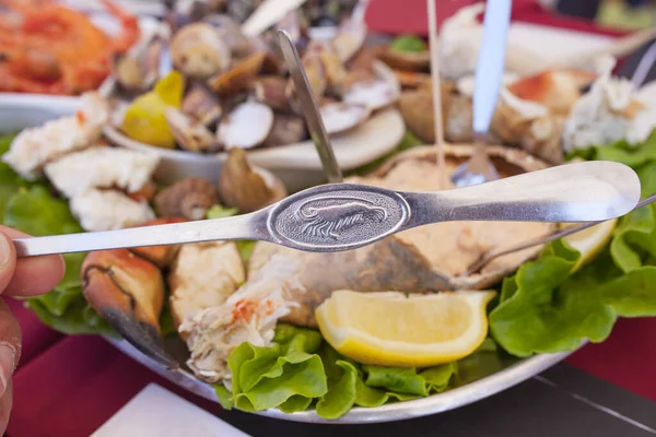 Lobster fork and portuguese seafood meal — Stock Photo, Image