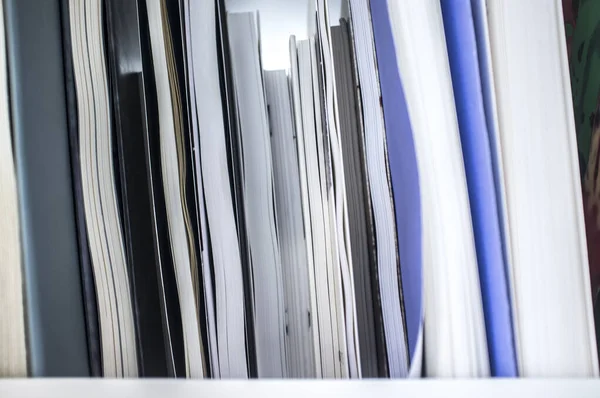 Books pile showing fore edge or text block on book shelf — Stock Photo, Image