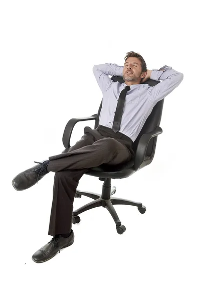 Young happy attractive businessman leaning relaxed sitting on office chair isolated on white — Zdjęcie stockowe