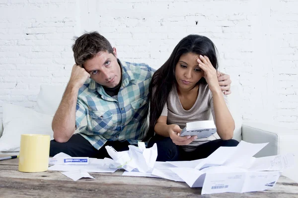 Young sad couple at home living room couch calculating monthly expenses worried in stress — 스톡 사진