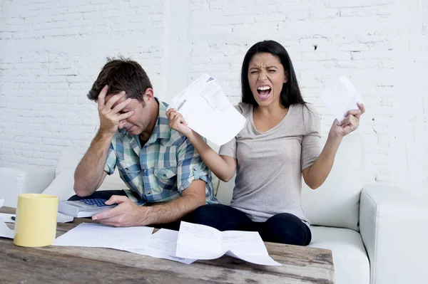 Young sad couple at home living room couch calculating monthly expenses worried in stress — 图库照片
