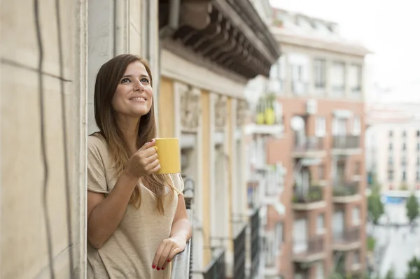 Beautiful woman relaxed cheerful drinking tea coffee at apartment balcony terrace — Stock Photo, Image