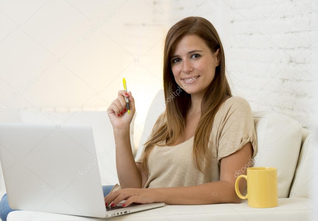 young beautiful woman working with laptop computer smiling happy or doing online internet shopping