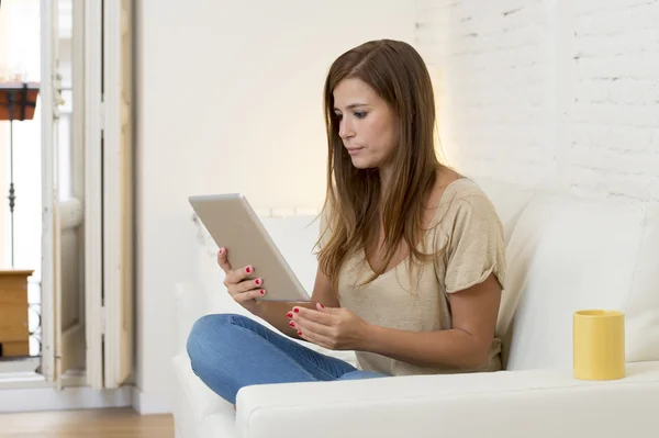 Beautiful woman smiling happy working at home with digital tablet computer pad — Stock fotografie