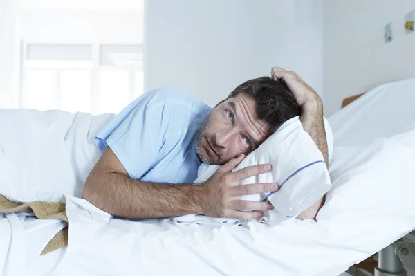 Desperate man at hospital bed alone sad and devastated suffering depression _ — Stock Photo, Image