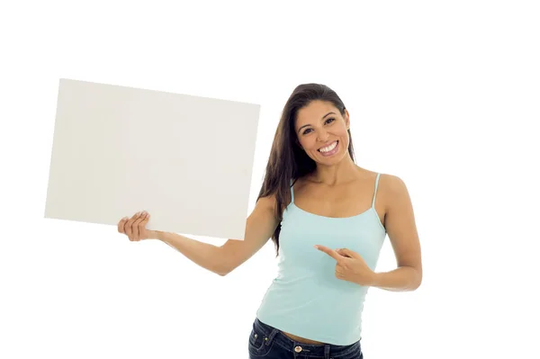 Young attractive and happy hispanic woman holding blank billboard with copy space — Stock Photo, Image