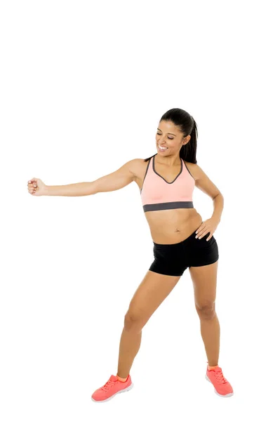 Young beautiful latin woman in fitness clothes dancing zumba in aerobic workout happy and excited — Stock Photo, Image